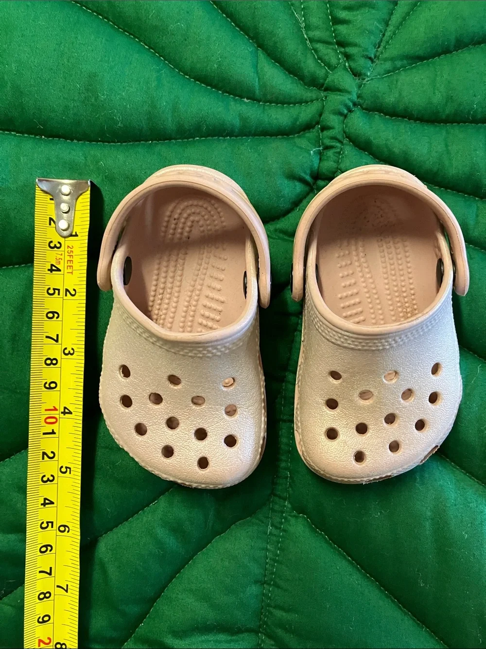 Baby infant crocs size 2/3, shimmer pink color.